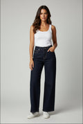# JEANS WIDE-LEG VITA ALTA – DEEP BLUE SCURO

Il perfetto equilibrio tra eleganza sartoriale e comfort quotidiano